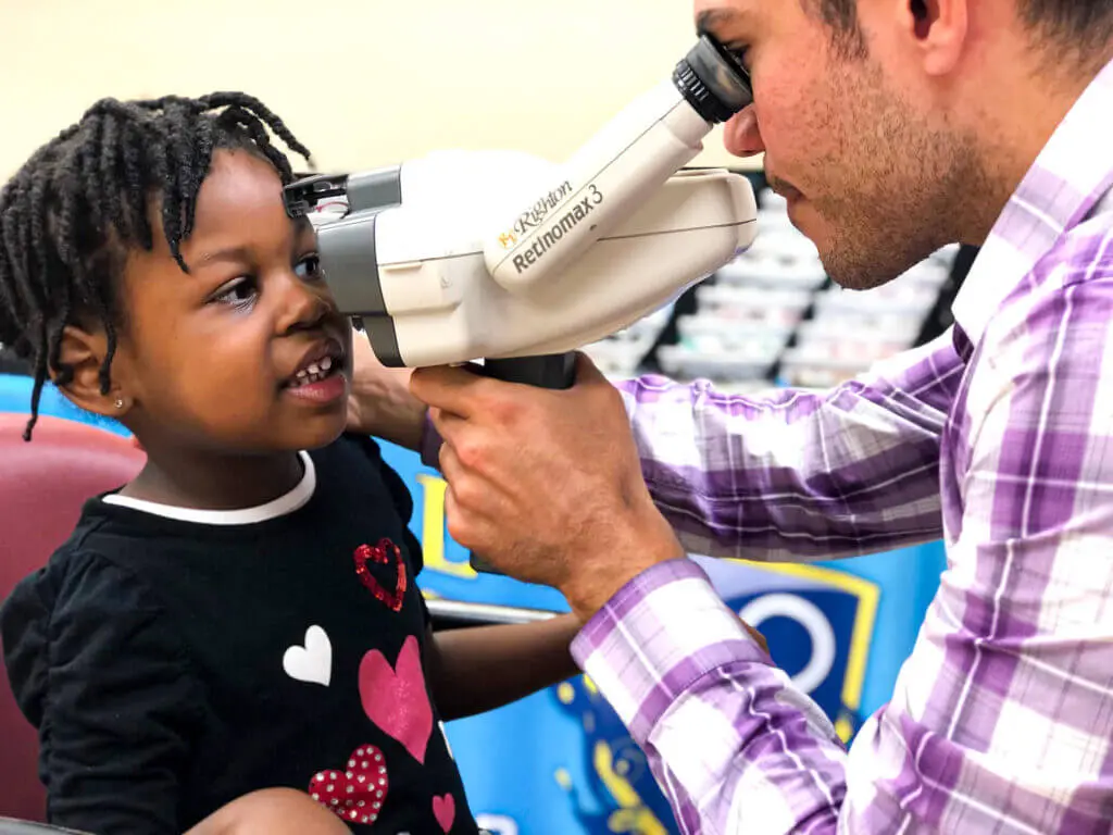 Optical Academy team caring for a student